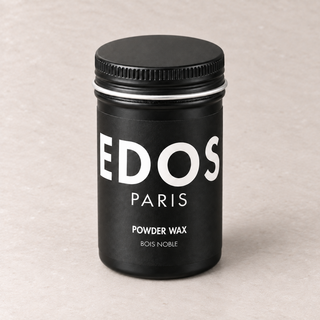 Powder Wax Bois Noble EDOS Paris, flacon noir fermé sur fond grège clair.