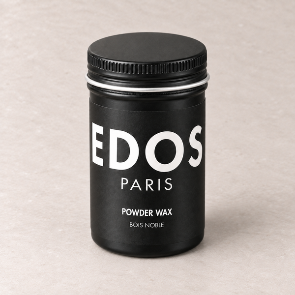 Powder Wax Bois Noble EDOS Paris, flacon noir fermé sur fond grège clair.