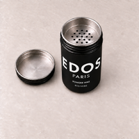 Powder Wax Bois Noble EDOS Paris, flacon ouvert et tamis métallique à trous réguliers.
